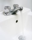 Sink with running water. Royalty Free Stock Photo