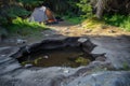 sinkhole at a campsite with a tent pitched at a safe distance