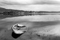 A sinking little boat on Trasimeno lake Umbria, with Passignan Royalty Free Stock Photo