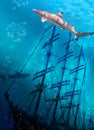 Sinking ship on sea bottom and sharks Royalty Free Stock Photo