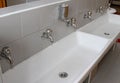 Sinks and washbasins with taps in the toilets of a nursery Royalty Free Stock Photo