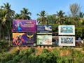 Large hoardings advertising casinos and real estate in the green tropical countryside of a