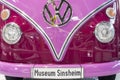 SINSHEIM, GERMANY - APRIL 8, 2018: Front of a pink Volkswagen bus vintage car with inscribed license plate `Museum Sinsheim`