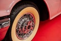 SINSHEIM, GERMANY - OCTOBER 16, 2018: Technik Museum. Particle view on the front of vintage car. Creamy colored wheel