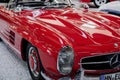 SINSHEIM, GERMANY - OCTOBER 16, 2018: Technik Museum. Perfectly polished red classic car with other vehicles behind Royalty Free Stock Photo