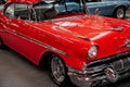 SINSHEIM, GERMANY - OCTOBER 16, 2018: Technik Museum. Shiny red retro car on exhibition with other vehicles at Royalty Free Stock Photo