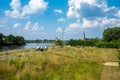 Sint Amands, Antwerp Province, Belgium - Seniors cycling at the banks of the river Scheldt