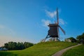 Sint-Janshuismolen Sint-Janshuis Mill windmill in Bruges on sunset, Belgium