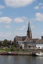 Sint-Martinuskerk Maastricht on the banks of the Maas Riveron, Maastricht, Netherlands. Brick walls of a historic church Royalty Free Stock Photo