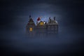 Sinterklaas and the Pieten on the rooftops at night Royalty Free Stock Photo