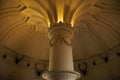 Inside of Pena Palace in Sintra, Lisbon district, Portugal. Close up of a corinthian capital and decorated ceiling.