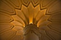 Inside of Pena Palace in Sintra, Lisbon district, Portugal. Close up of a corinthian capital and decorated ceiling.