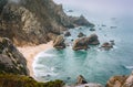 Sintra, Portugal. Rocky coastline of Praia da Ursa near Cape Roca and morning light and Atlantic Ocean Royalty Free Stock Photo