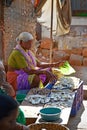 SIOLIM, GOA, INDIA - CIRCA DECEMBER 2013: An elderly woman sells