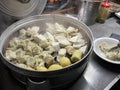 Fish dumplings, potatoes, cabbage, eggs inside a pot