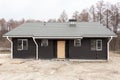 SIP panel house with new gray metal tile roof,white rain gutter and insulation. Royalty Free Stock Photo