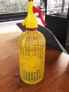 Siphon water bottle yellow over a bar table Royalty Free Stock Photo