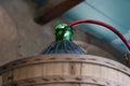 Demijohn close up while siphoning red wine