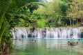 SIQUIJOR, PHILIPPINES - FEBRUARY 9, 2018: People enjoy Cambugahay Falls on Siquijor island, Philippine