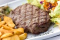 Sirloin steak with chips ,mushrooms,salad Royalty Free Stock Photo