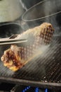 Sirloin steak cooking on stove Royalty Free Stock Photo