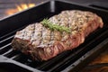 sirloin steak with grill marks on a cast iron pan Royalty Free Stock Photo