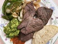Sirloin Steak with Red Salsa, Tortillas, Onions, Green Pepper and Guacamole