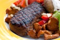 Sirloin strip steak with baked potato and chantere Royalty Free Stock Photo