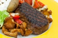 Sirloin strip steak with baked potato and chantere Royalty Free Stock Photo