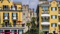 Sirmione, Italy. Modern hotels and part of Scaligero Castle between the houses .