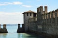 Sirmione Scaliger Castle with moat, rare example of medieval port fortification, Sirmione, Lake Garda, Italy Royalty Free Stock Photo