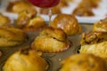 Pouring water with sugar on fresh baked muffins Royalty Free Stock Photo