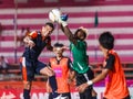 SISAKET THAILAND-MAY 24: Mfeyet Njoya Souleymane of Sisaket Utd. (green) in action during Regional League between Sisaket Utd. an