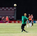 SISAKET THAILAND-MAY 24: Mfeyet Njoya Souleymane of Sisaket Utd. (green) in action during Regional League between Sisaket Utd. an