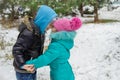 Sister and brother having fun in snowy forest Royalty Free Stock Photo