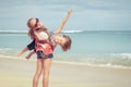 Sister and brother playing on the beach at the day time. Royalty Free Stock Photo