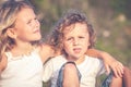 Sister and brother playing on the beach at the day time. Royalty Free Stock Photo