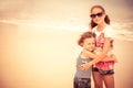 Sister and brother playing on the beach at the day time. Royalty Free Stock Photo