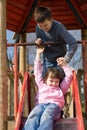Sister And Brother On Slide Royalty Free Stock Photo