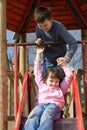 Sister And Brother On Slide