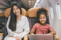 Sister with Children happy smile in flight passenger cabin happy to travel concept