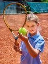 Sister girl athlete with racket and ball