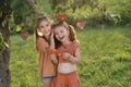 Sister girls at decorated Christmas tree with puzzle cards on Autism Day Royalty Free Stock Photo