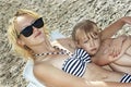 Sister girls resting on the beach Royalty Free Stock Photo