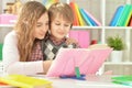 Sister helping her brother with homework Royalty Free Stock Photo