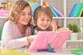 Sister helping her brother with homework Royalty Free Stock Photo