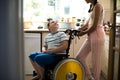 Sister helping her disabled brother in the kitchen