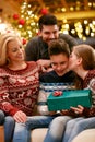 Sister kissing brother for Christmas Royalty Free Stock Photo