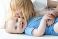 Sister kissing her baby brother Royalty Free Stock Photo