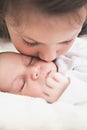Sister kissing her newborn brother Royalty Free Stock Photo